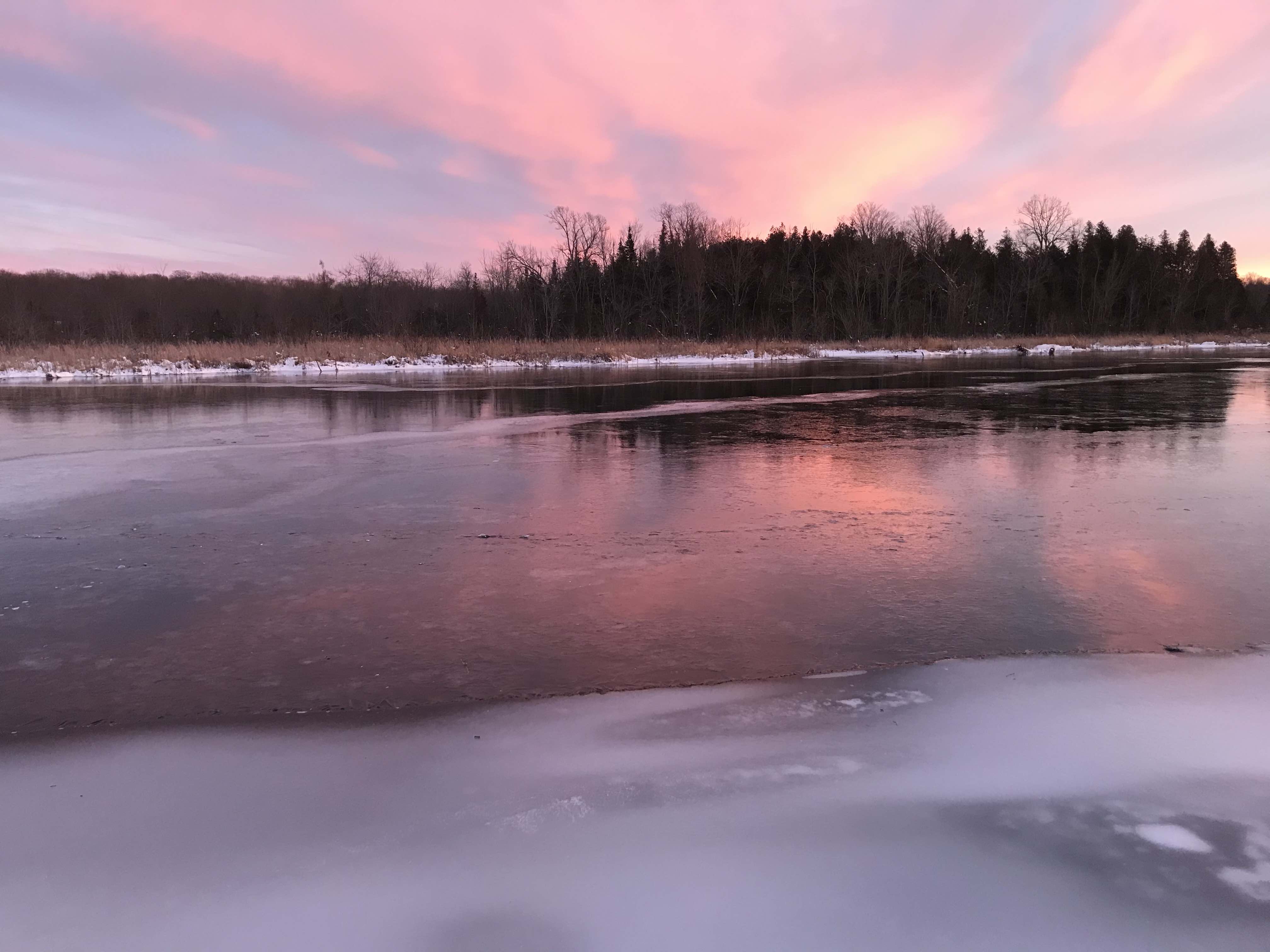 Sunrise over a frozen river